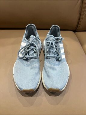 Adidas Light Blue NMD R1 Knit Sneakers with White Stripes.